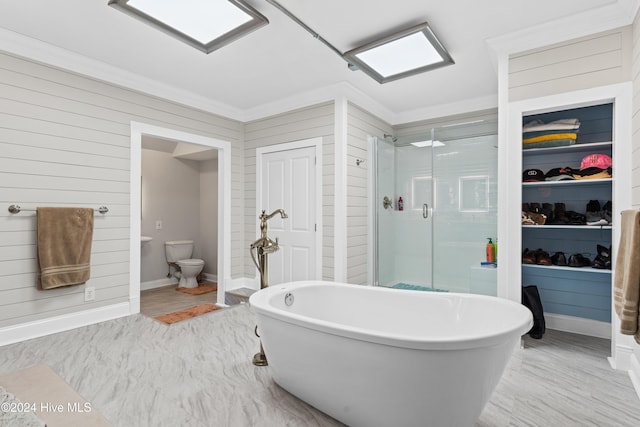 bathroom with crown molding, toilet, hardwood / wood-style floors, and shower with separate bathtub