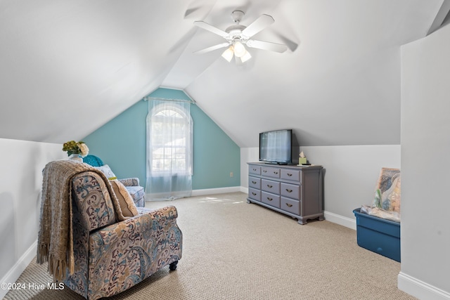 sitting room with light carpet, ceiling fan, and lofted ceiling