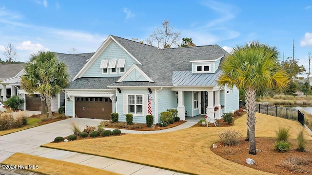 view of front of home with a porch and a garage