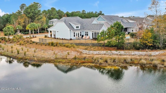 rear view of house with a water view