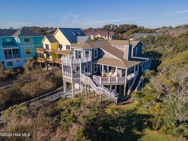 back of property with a wooden deck