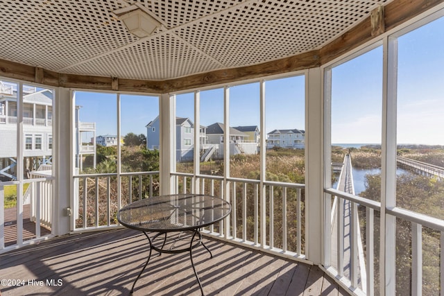 sunroom with a water view