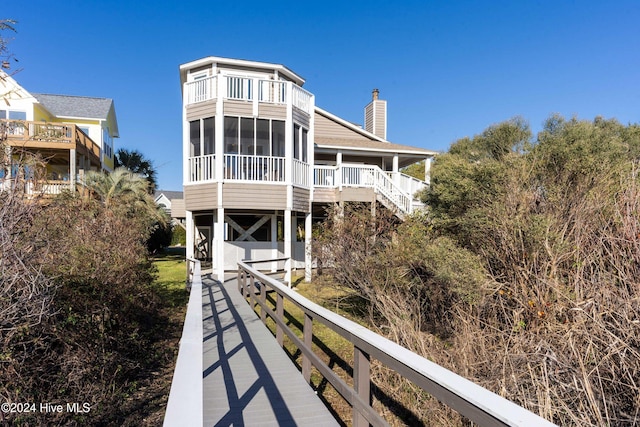 back of property featuring a sunroom