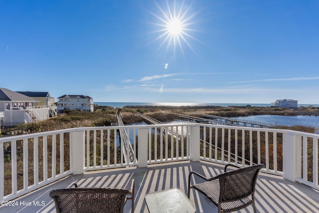 wooden deck featuring a water view