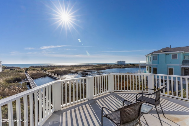 deck featuring a water view