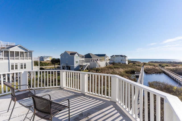 wooden deck featuring a water view