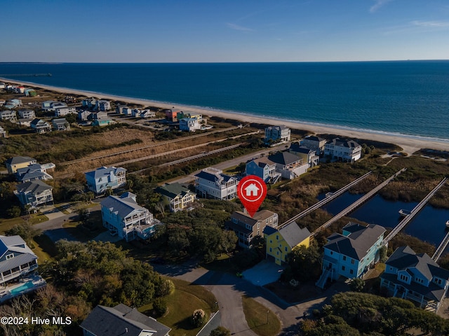 drone / aerial view with a view of the beach and a water view