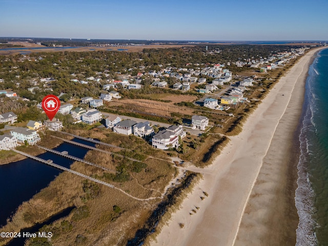 bird's eye view with a water view and a view of the beach