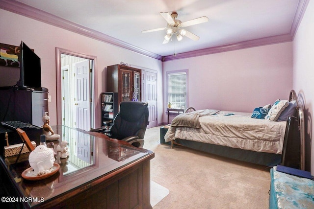 carpeted bedroom featuring ceiling fan, ornamental molding, and a closet