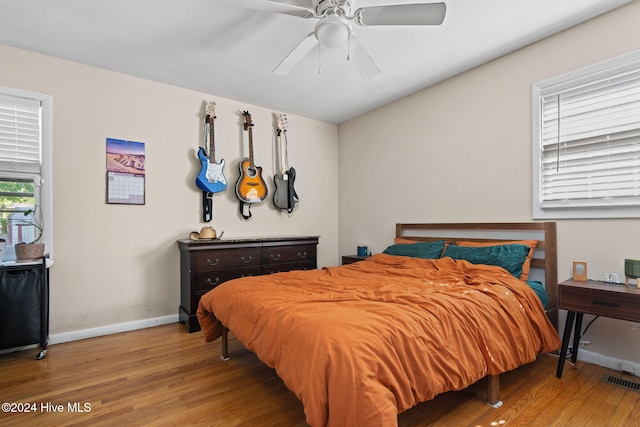 bedroom with hardwood / wood-style floors and ceiling fan