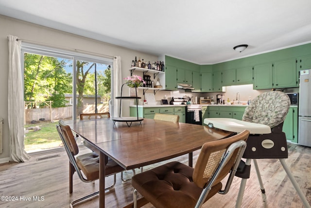 dining area with light wood-type flooring