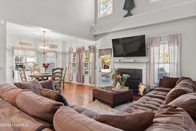 living room featuring a chandelier and hardwood / wood-style flooring