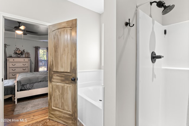 bathroom featuring ceiling fan, separate shower and tub, and hardwood / wood-style floors