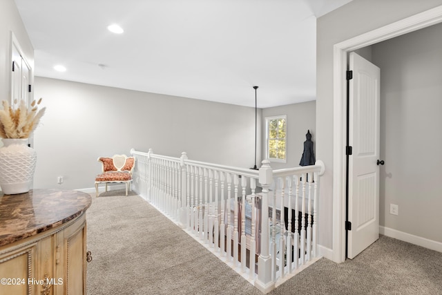 hallway with light carpet