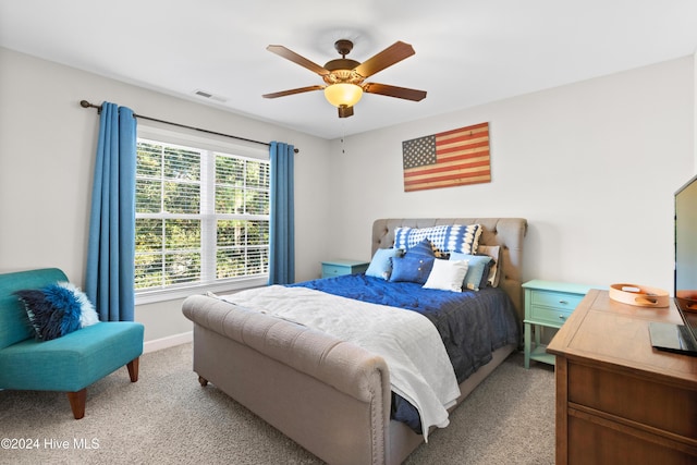 carpeted bedroom featuring ceiling fan