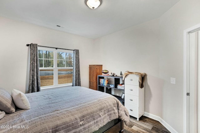 bedroom featuring wood-type flooring