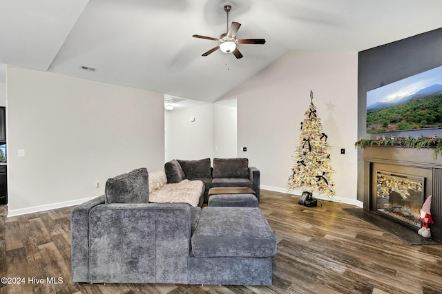 living room featuring dark hardwood / wood-style flooring, ceiling fan, and lofted ceiling