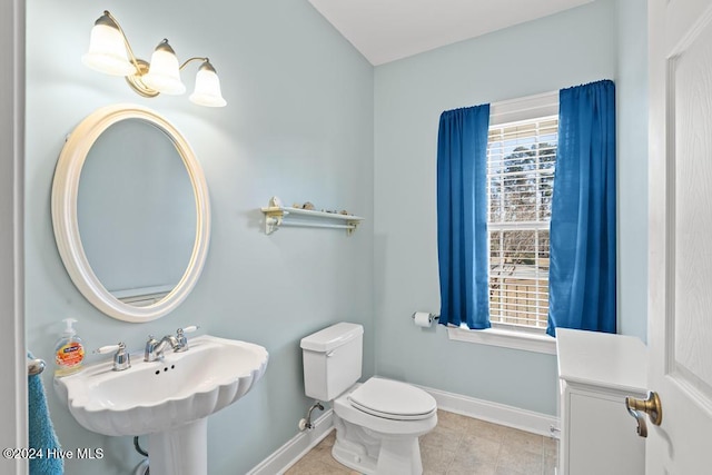 bathroom with tile patterned floors, sink, and toilet