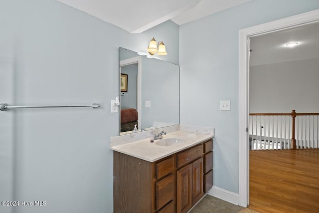 bathroom with vanity and wood-type flooring