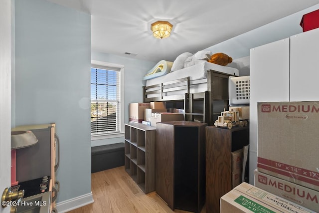 bedroom with light hardwood / wood-style floors