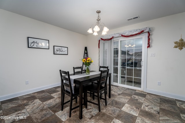 dining area with a notable chandelier