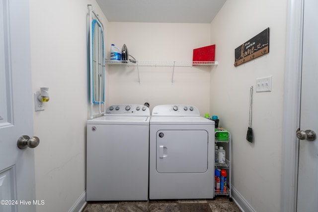 clothes washing area featuring washing machine and clothes dryer