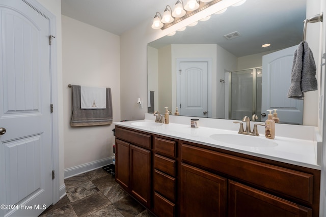 bathroom with vanity and walk in shower