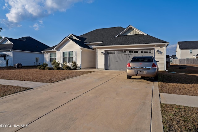 ranch-style home with a garage