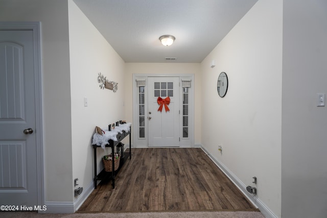 entrance foyer featuring dark hardwood / wood-style flooring