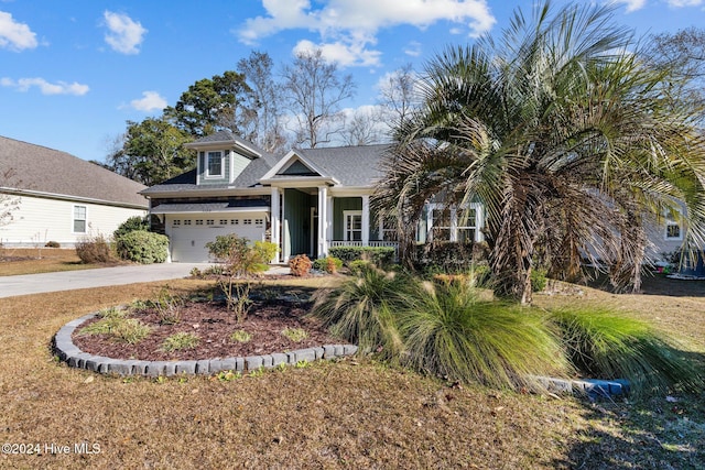 view of front of house featuring covered porch and a garage