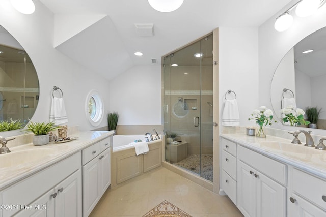 bathroom with plus walk in shower, vanity, tile patterned floors, and lofted ceiling