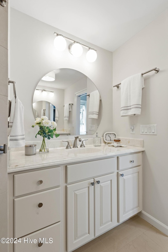 bathroom with tile patterned flooring and vanity