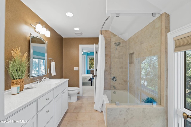 full bathroom with tile patterned floors, vanity, shower / bath combination with curtain, and toilet