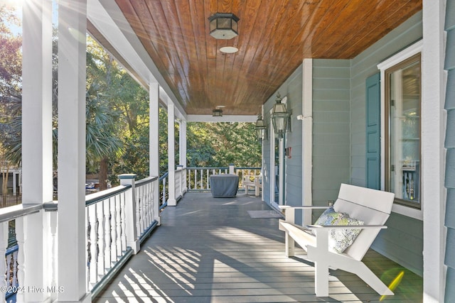 wooden deck featuring covered porch