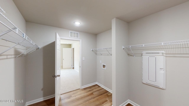 spacious closet featuring hardwood / wood-style flooring