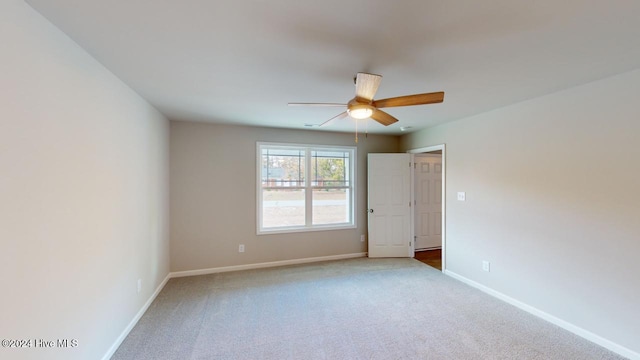 empty room with carpet and ceiling fan