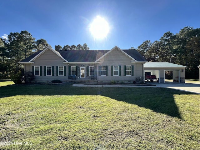 ranch-style house featuring a front yard and a carport