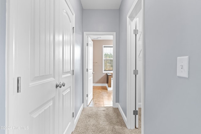 corridor with light colored carpet