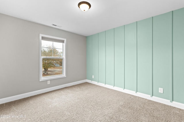 unfurnished room with carpet flooring