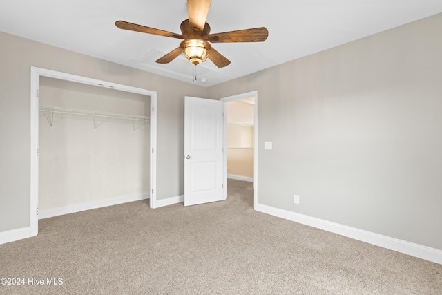 unfurnished bedroom with light carpet, a closet, and ceiling fan