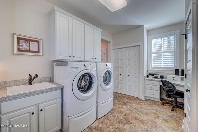 laundry room featuring cabinets, separate washer and dryer, and sink