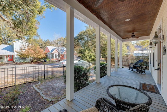 deck with ceiling fan and a porch