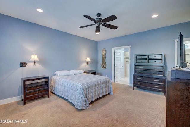 bedroom featuring light carpet and ceiling fan