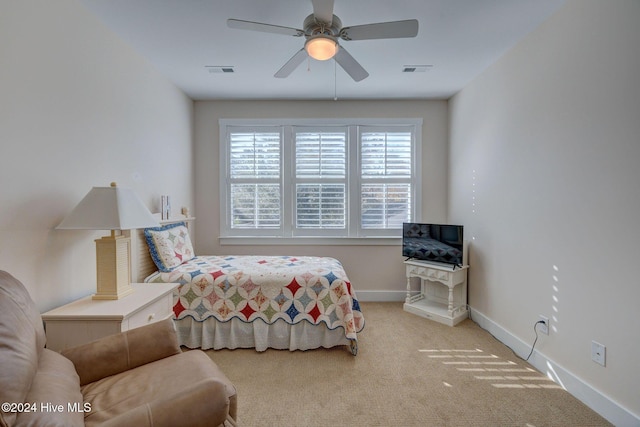 bedroom featuring ceiling fan and light colored carpet