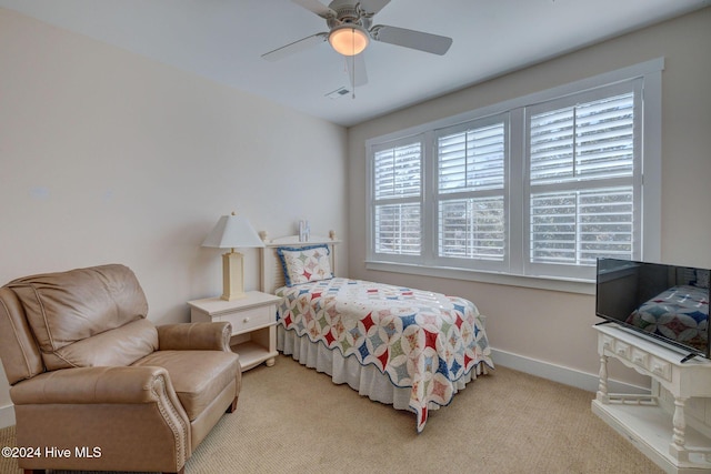 carpeted bedroom with ceiling fan