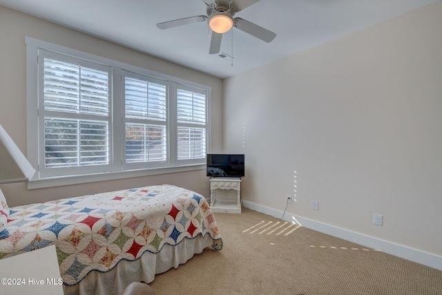 carpeted bedroom featuring ceiling fan