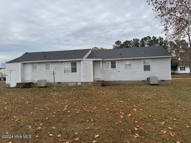 rear view of property with cooling unit