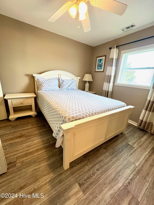 bedroom featuring dark hardwood / wood-style floors and ceiling fan