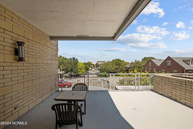 balcony with a patio area and a residential view