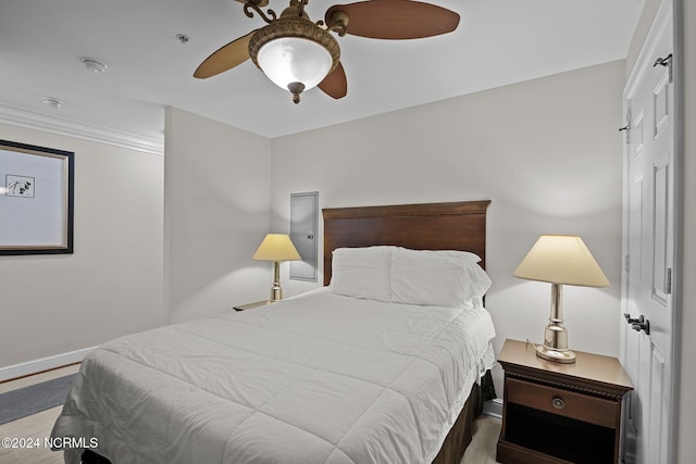 bedroom with ceiling fan and wood finished floors